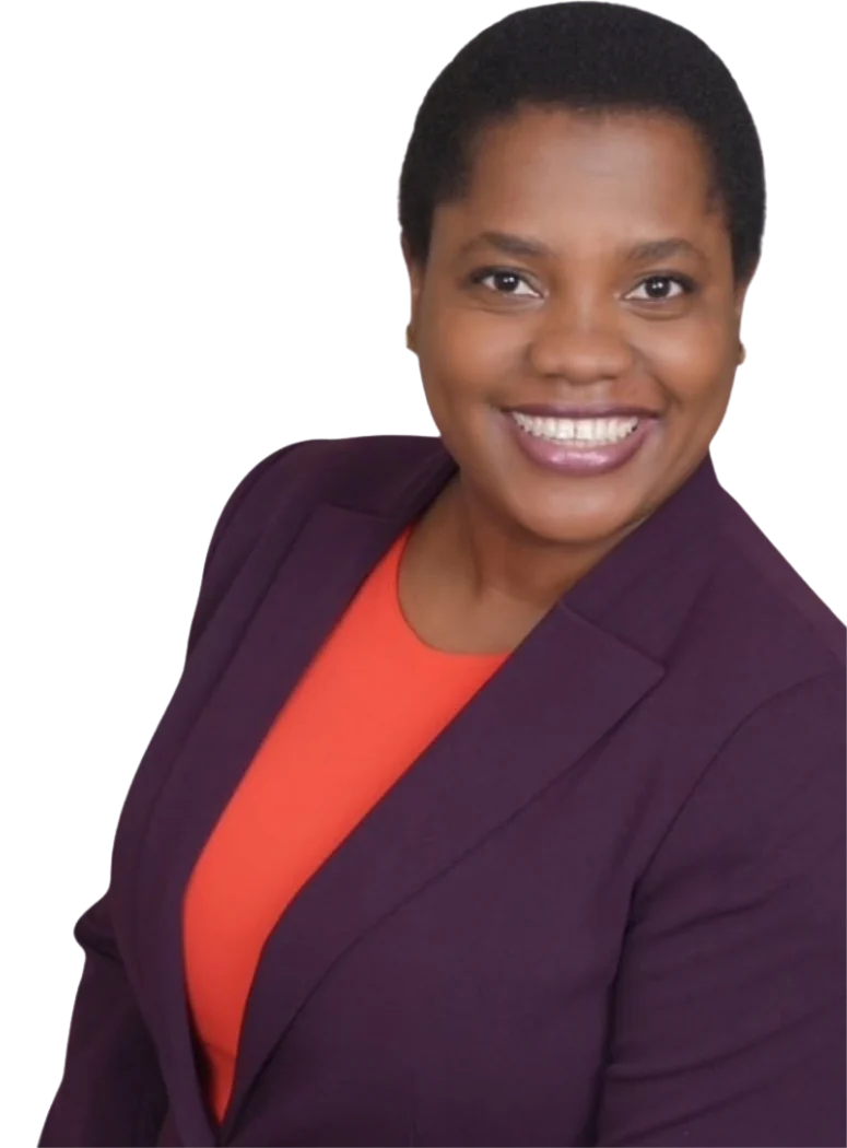 Enala Mwashitete, smiling, in a plum blazer.